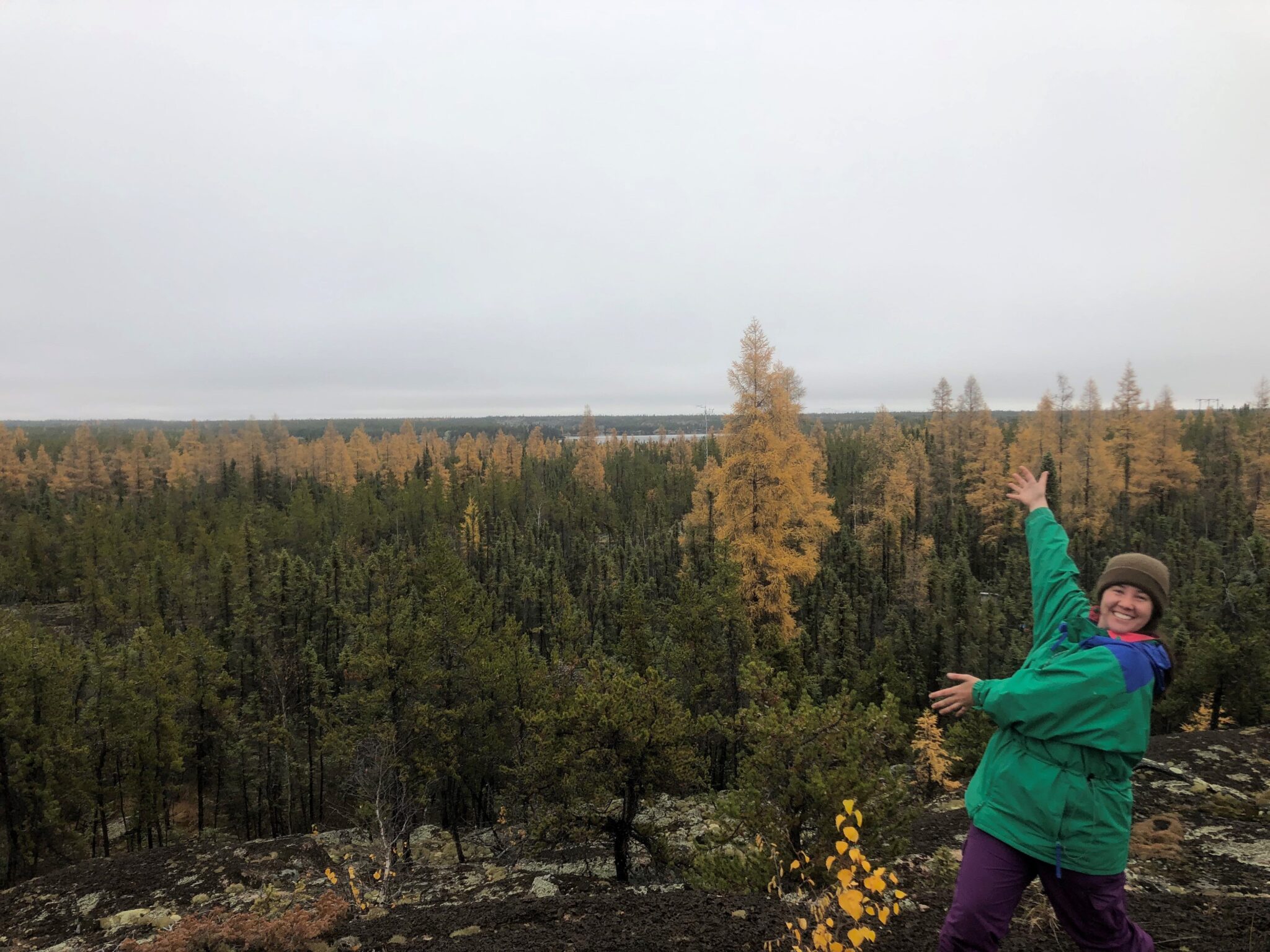 Nia points at the forest